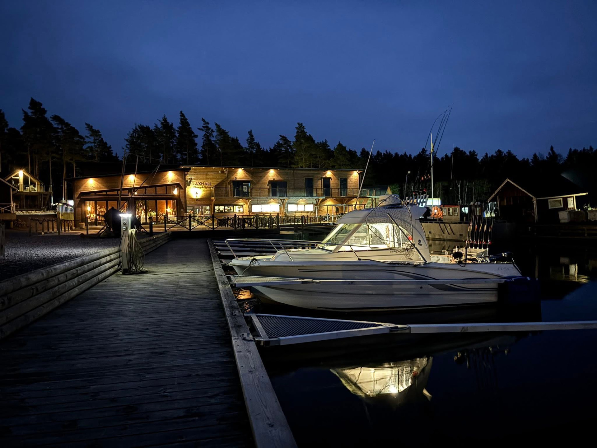 The trolling boat moored at Laxhall's jetty on Torsö in the evening